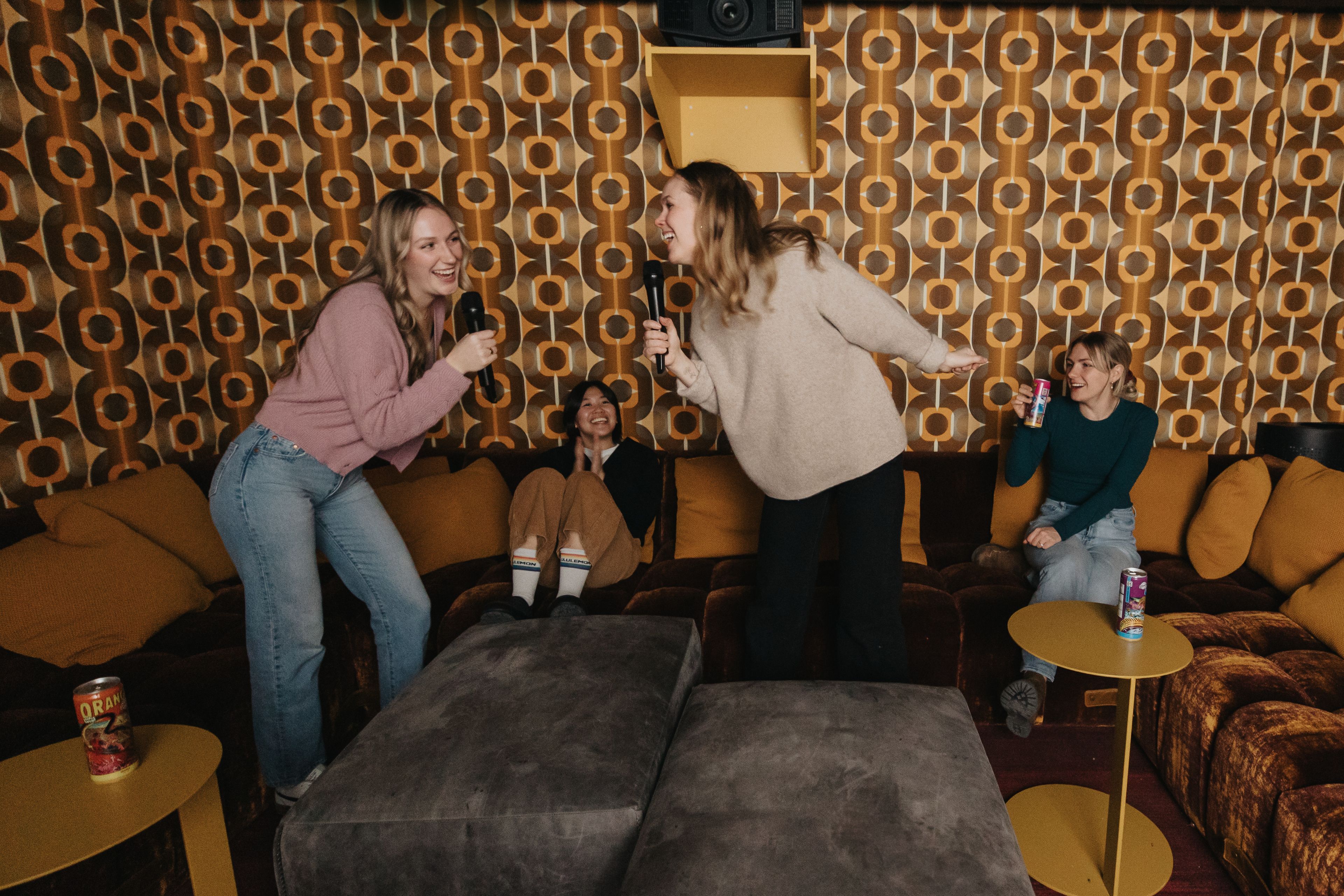 Friends singing karaoke at Moxy Hotel in Banff.