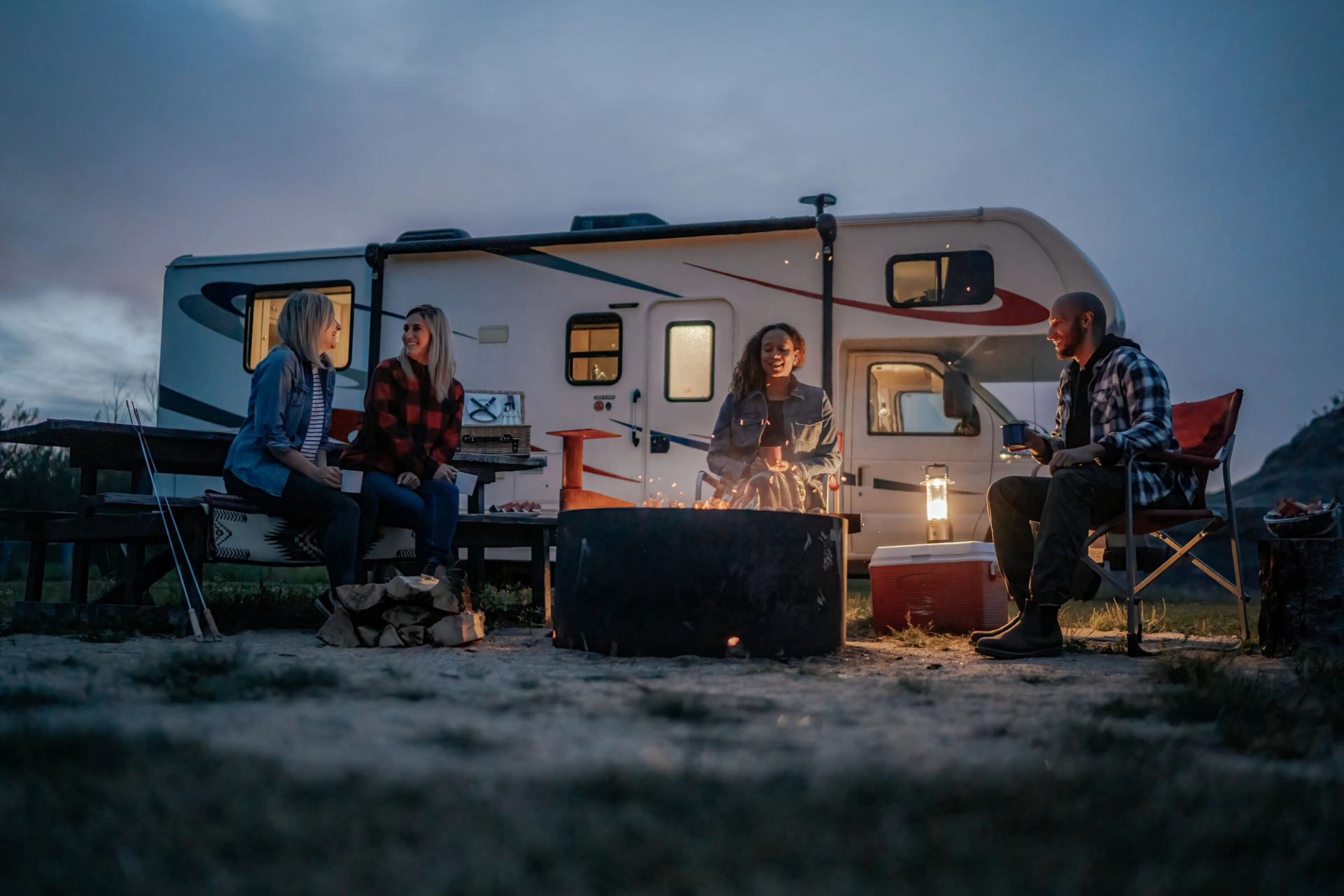 A group of RVers around a campfire.