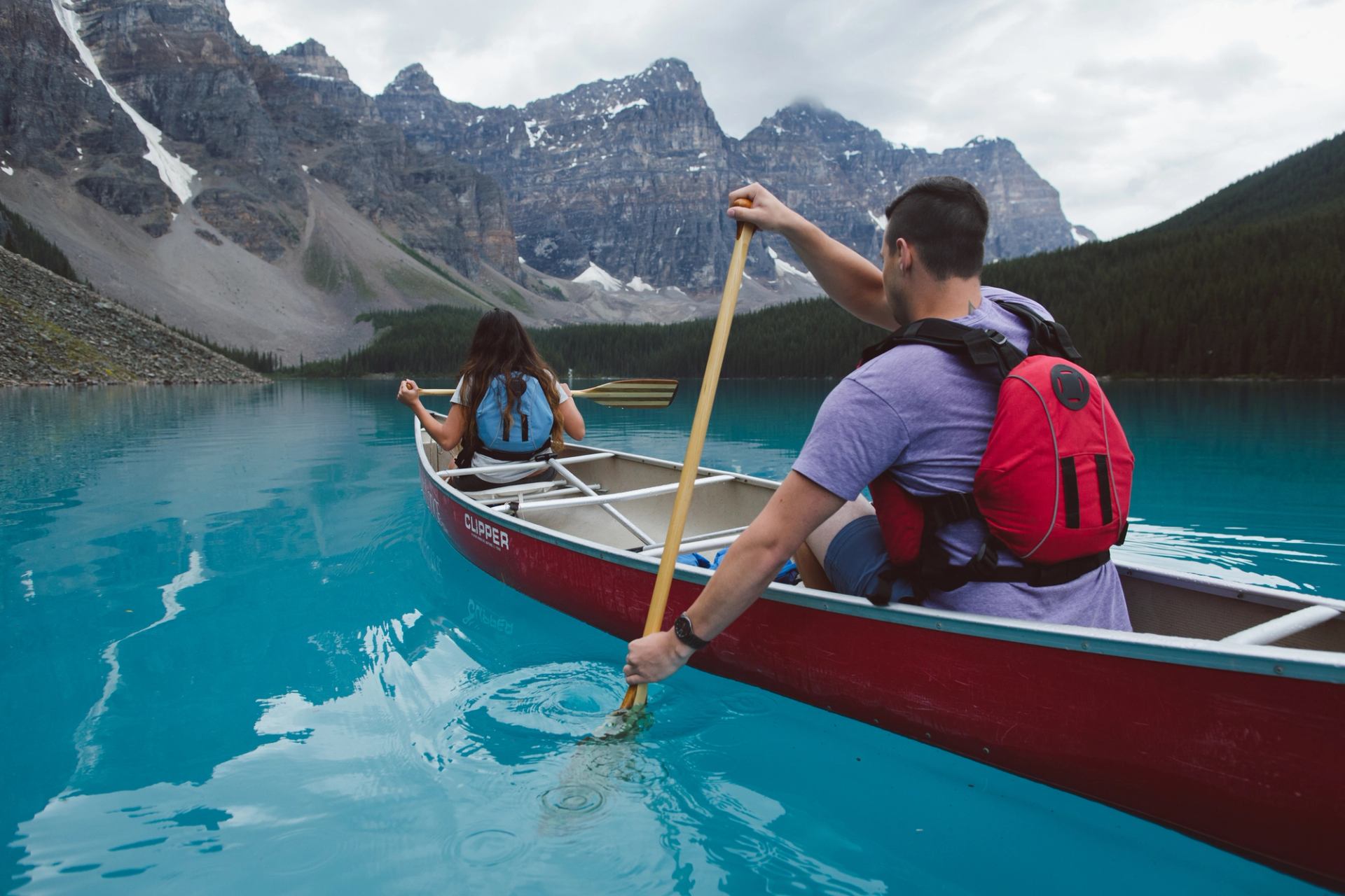 Scenic shot of people canoeing on Moraine Lake.