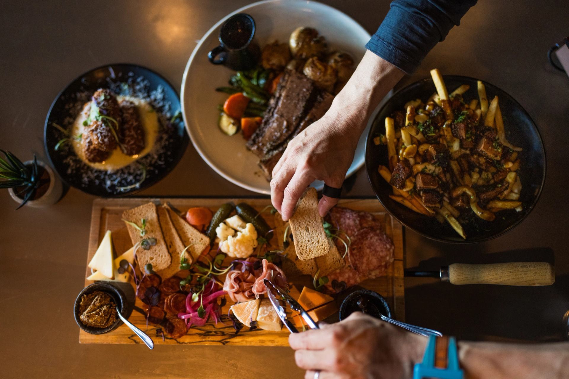 An elegant charcuterie board, poutine, steak dish and more at the Maligne Range restaurant.