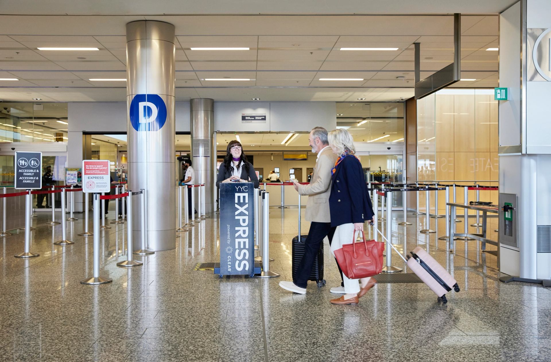 Travellers arrive at the YYC Express welcome station.