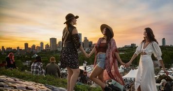 Friends enjoying the Edmonton Folk Festival with downtown Edmonton in the background