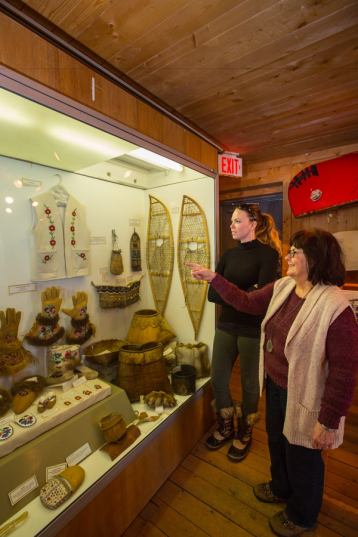 People exploring the Bicentennial Museum in Fort Chipewyan.