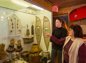 People exploring the Bicentennial Museum in Fort Chipewyan.