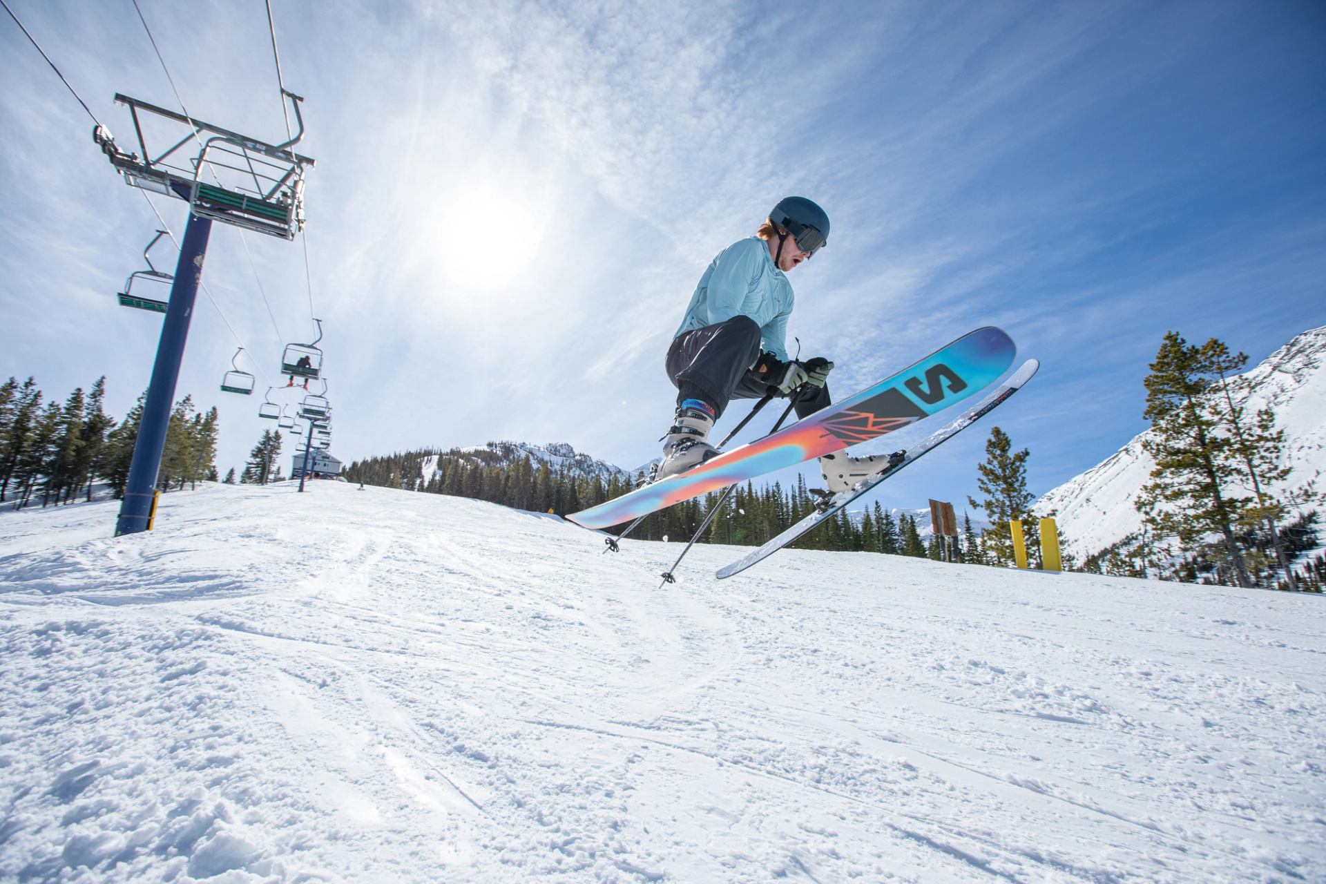 A skier catches air at Castle Mountain Resort in spring.