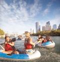 People rafting down the Bow River in Calgary