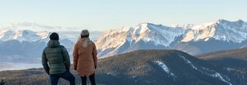 Hikers stop to take in the view while winter hiking in William A. Switzer Provincial Park