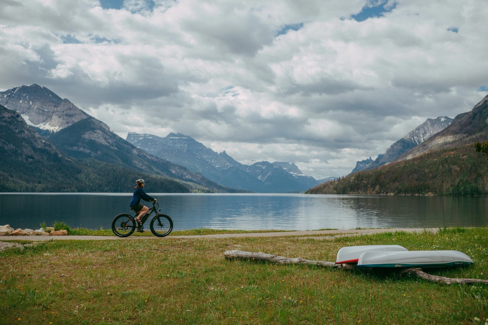 Person riding e-bike along the shores of Waterton Lakes.