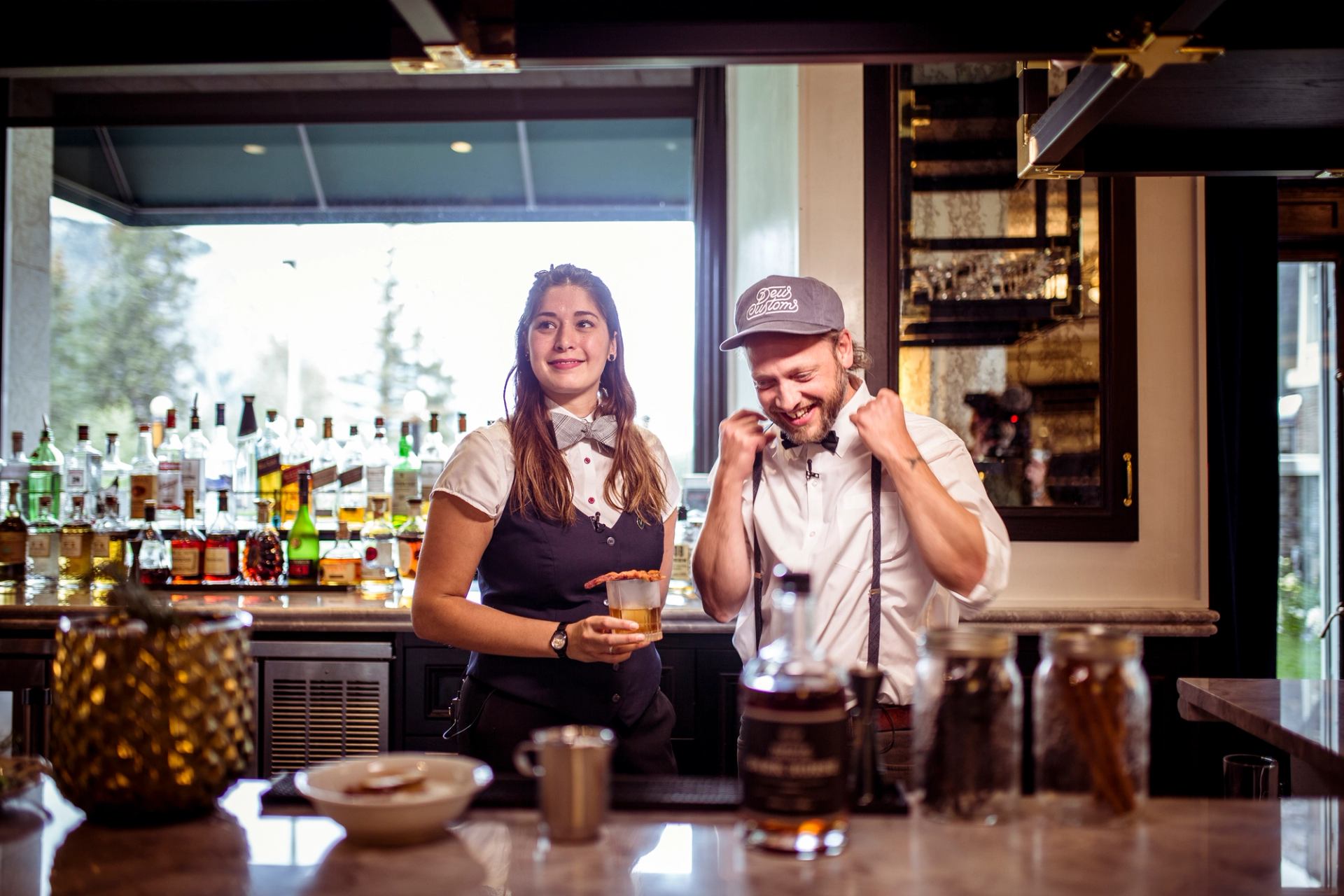 Two bartenders prepare to mix drinks at the Fairmont Banff Springs.