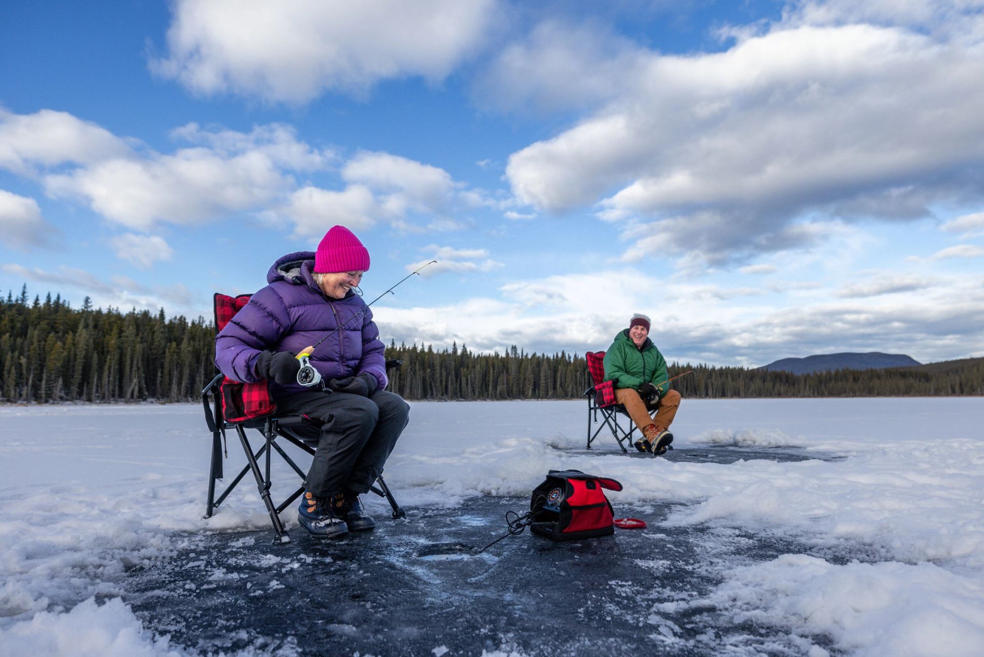 A couple ice fishing in Nordegg.