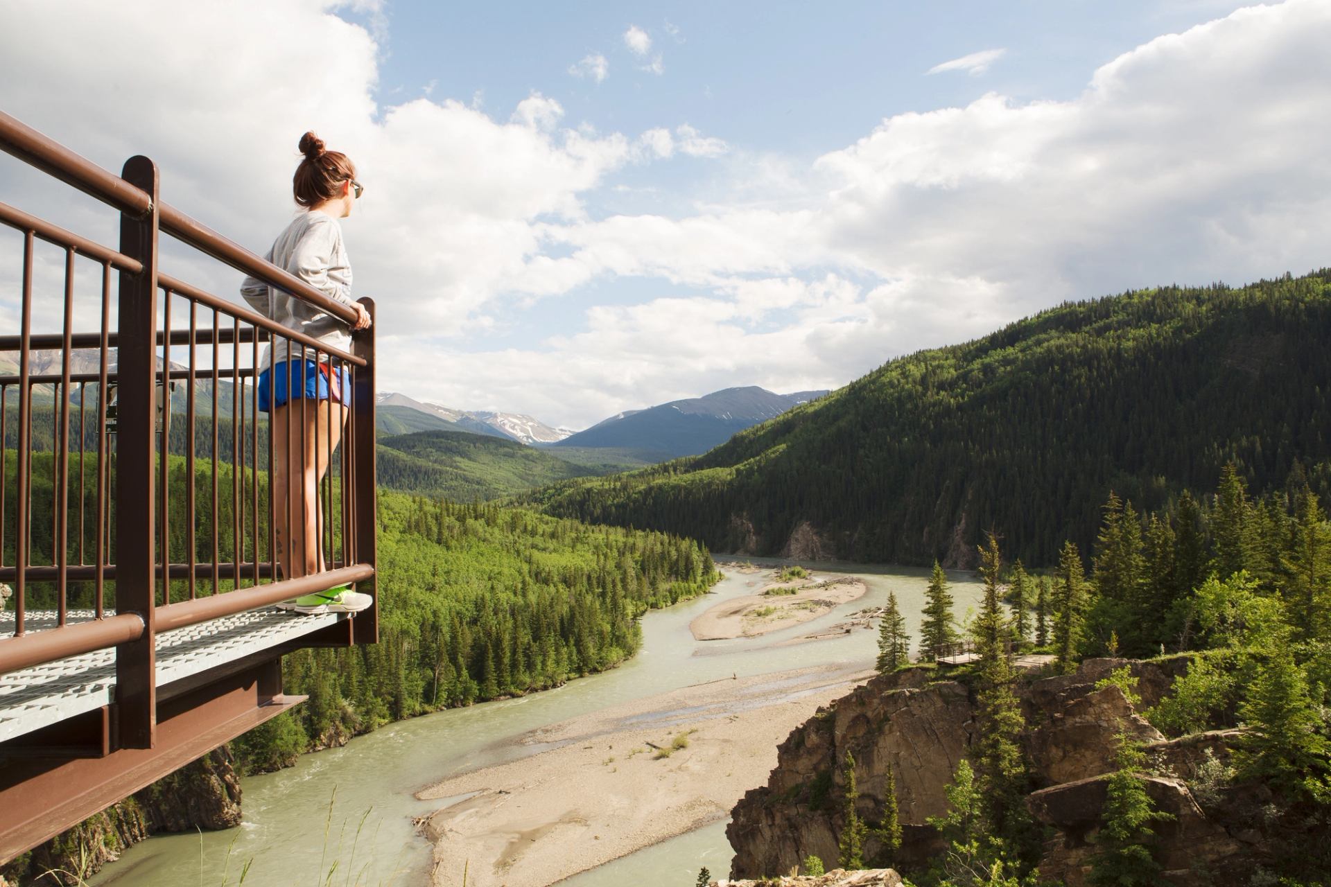 Woman on a viewing platform overlooking the river at Sulphur Gates in the Willmore Wilderness Park