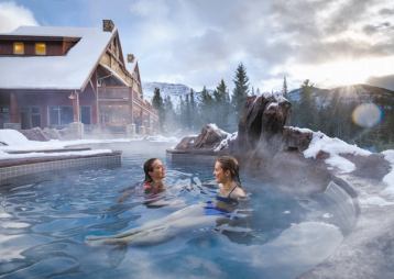 People enjoying the hot tub at the Hidden Ridge Resort