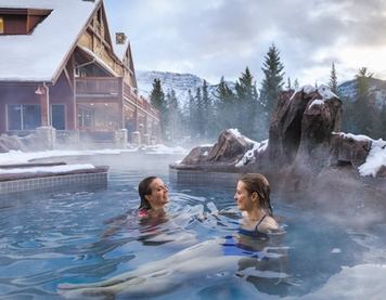 People enjoying the hot tub at the Hidden Ridge Resort