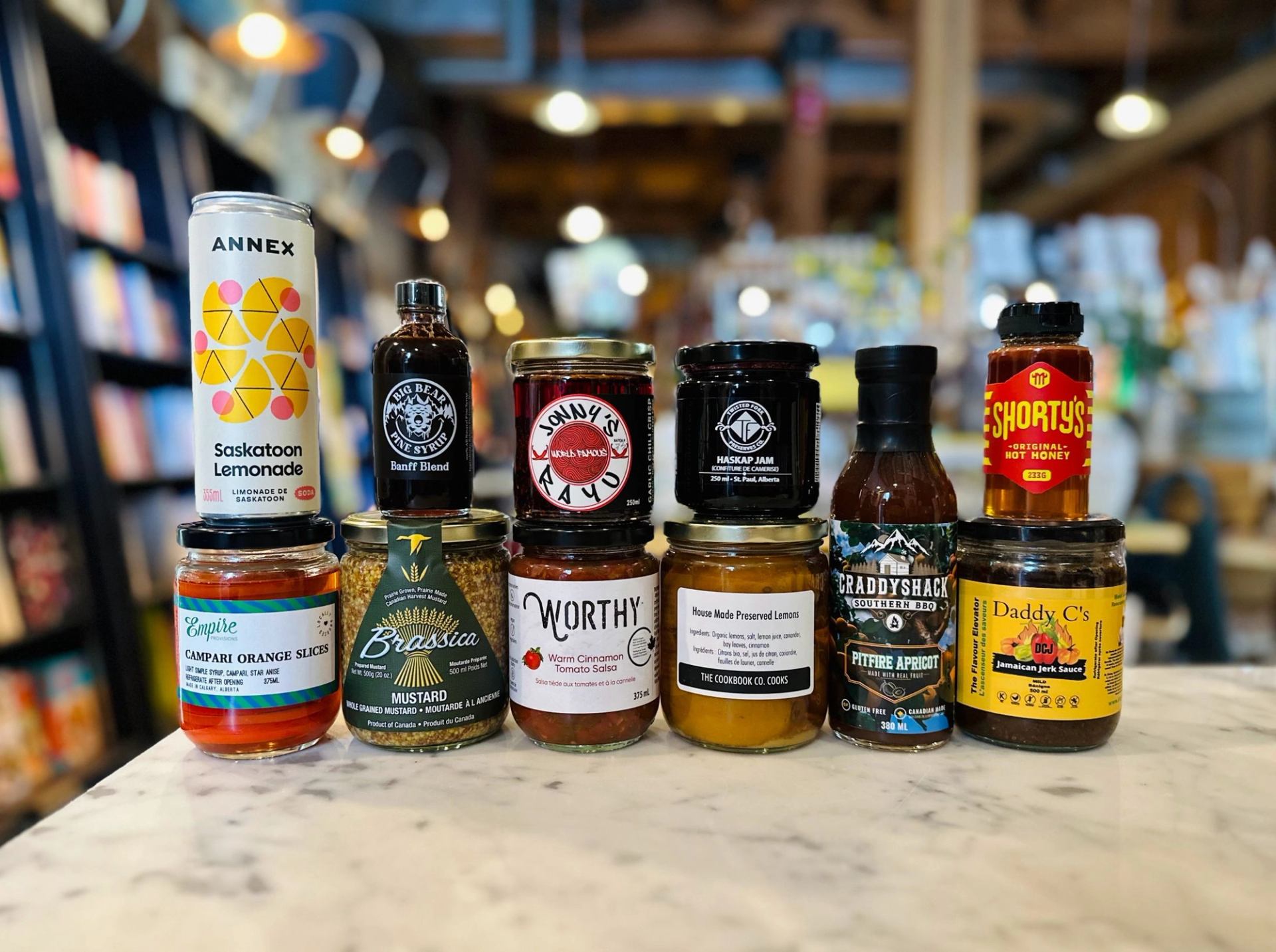 A selection of Alberta-made pantry items, including mustard, pickles and more are displayed.
