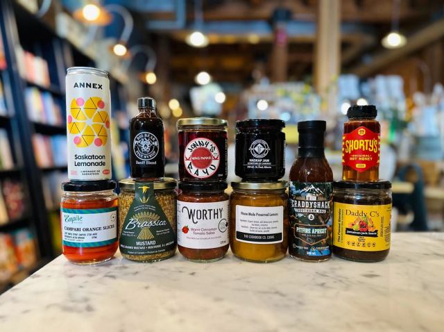 A selection of Alberta-made pantry items, including mustard, pickles and more are displayed.