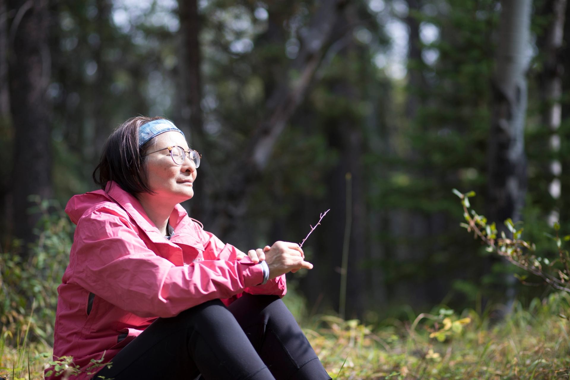 A woman forest bathing in Banff National Park