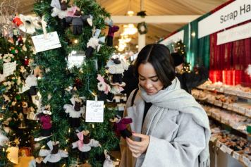 A shopper browsing at the Spruce Meadows International Christmas Marker