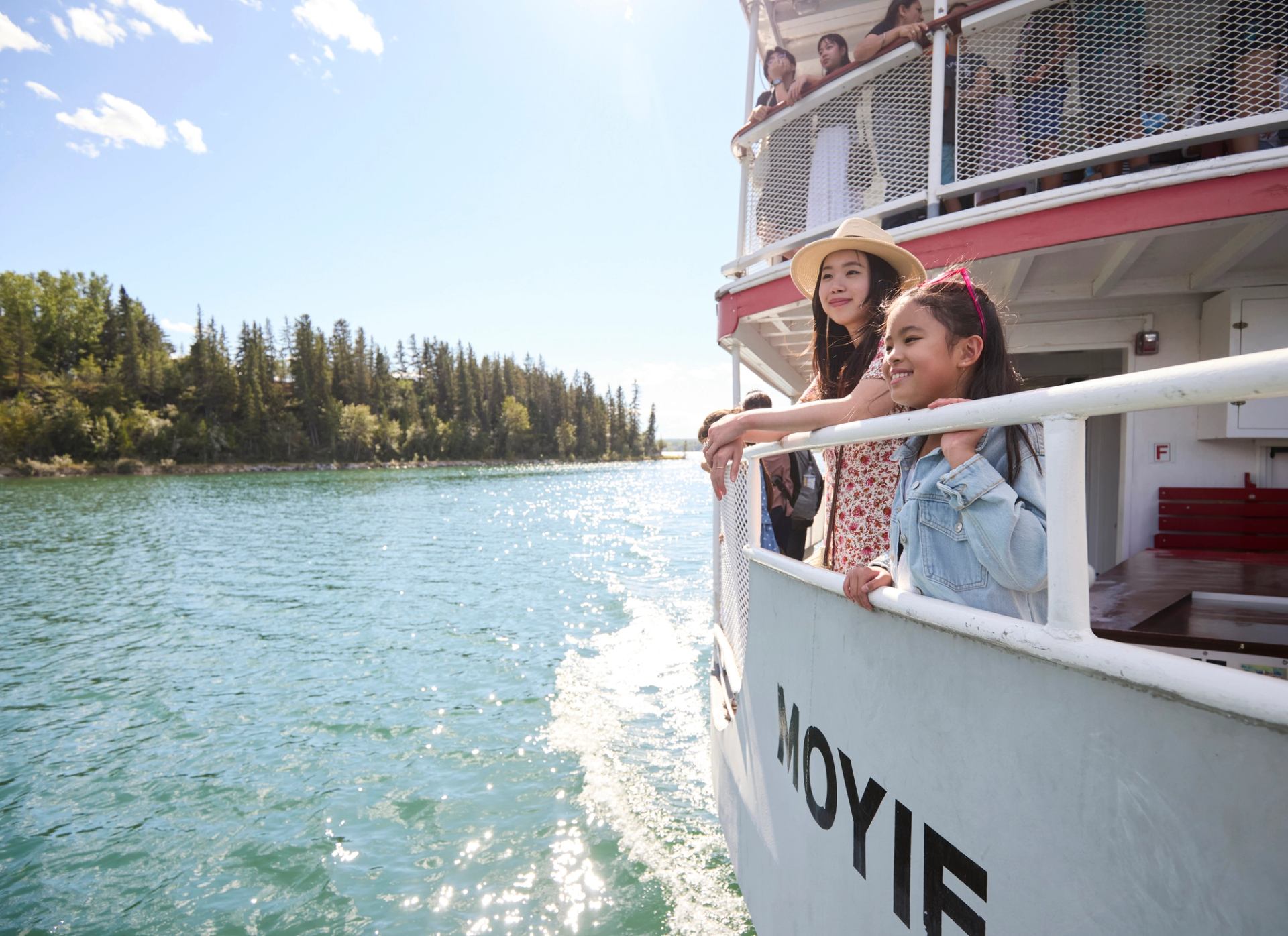 A mother and young girl on the starboard side of the SS Moyie paddle boat at Heritage Park.