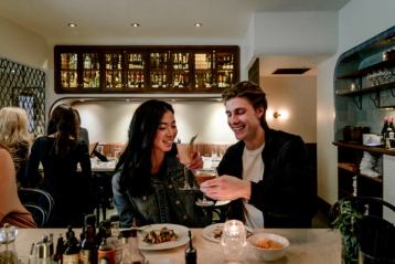 Couple drinking cocktails at clementime bar in edmonton