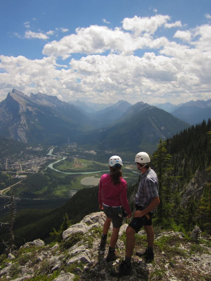 Climbers on the top of a mountain in Banff National Park