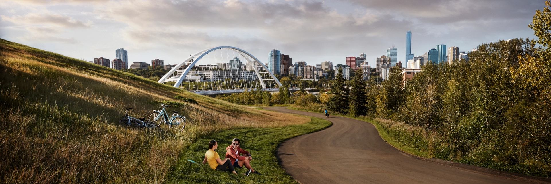 Couple along a bike path near the Walterdale Bridge in Edmonton