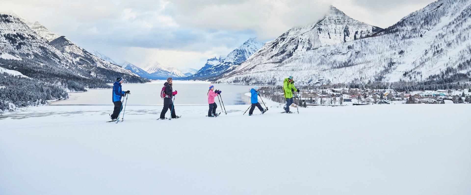 Family enjoying a guided snowshoe tour with Dark Sky Guides