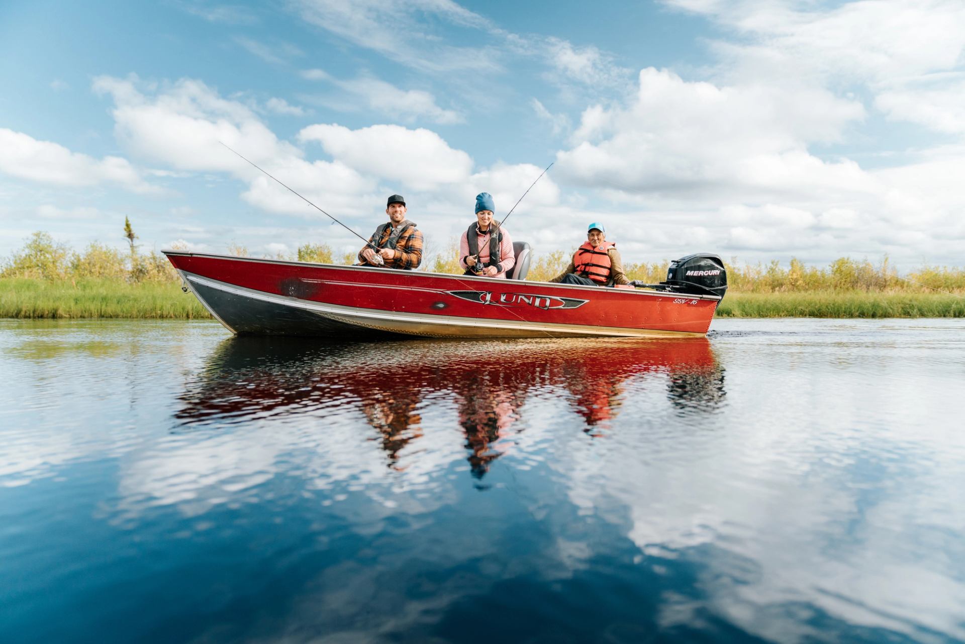 People fishing off of a boat in Northern Alberta