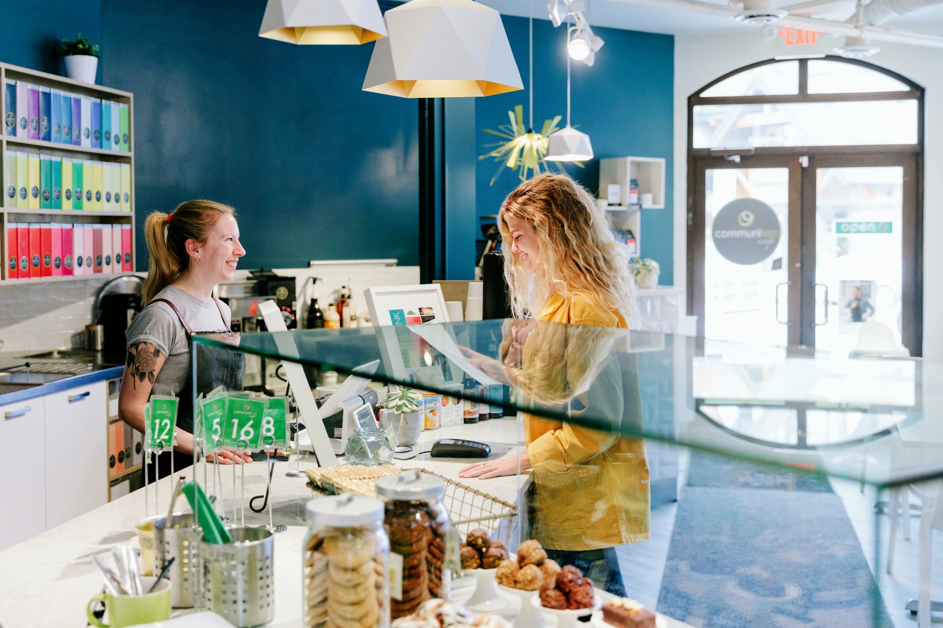 Woman ordering food at Communitea Cafe in Canmore.