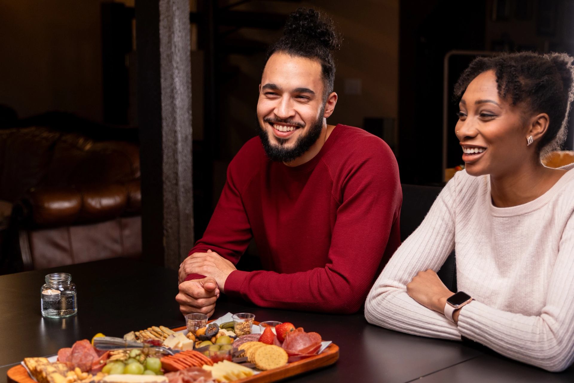 A couple enjoying a food plate at Running Reins Ranch.