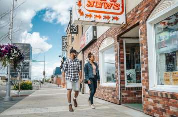 Couple walking through downtown Grande Prairie