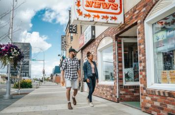 Couple walking through downtown Grande Prairie