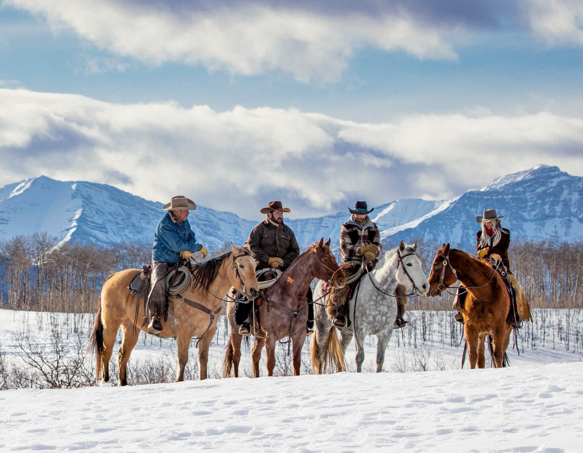 People horseback riding in winter