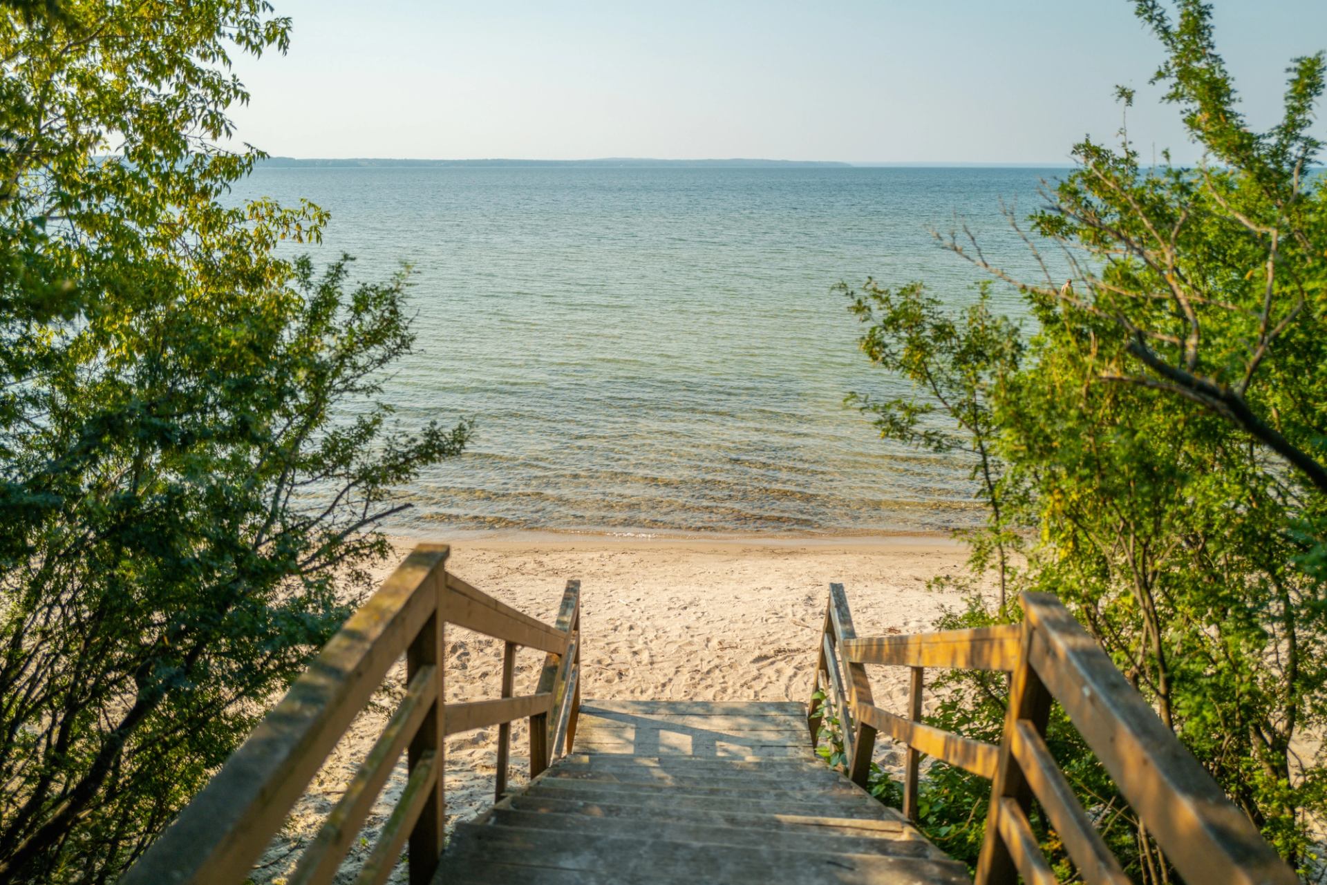 Stairway to the sandy beach and clear water at Cold Lake Provincial Campground.