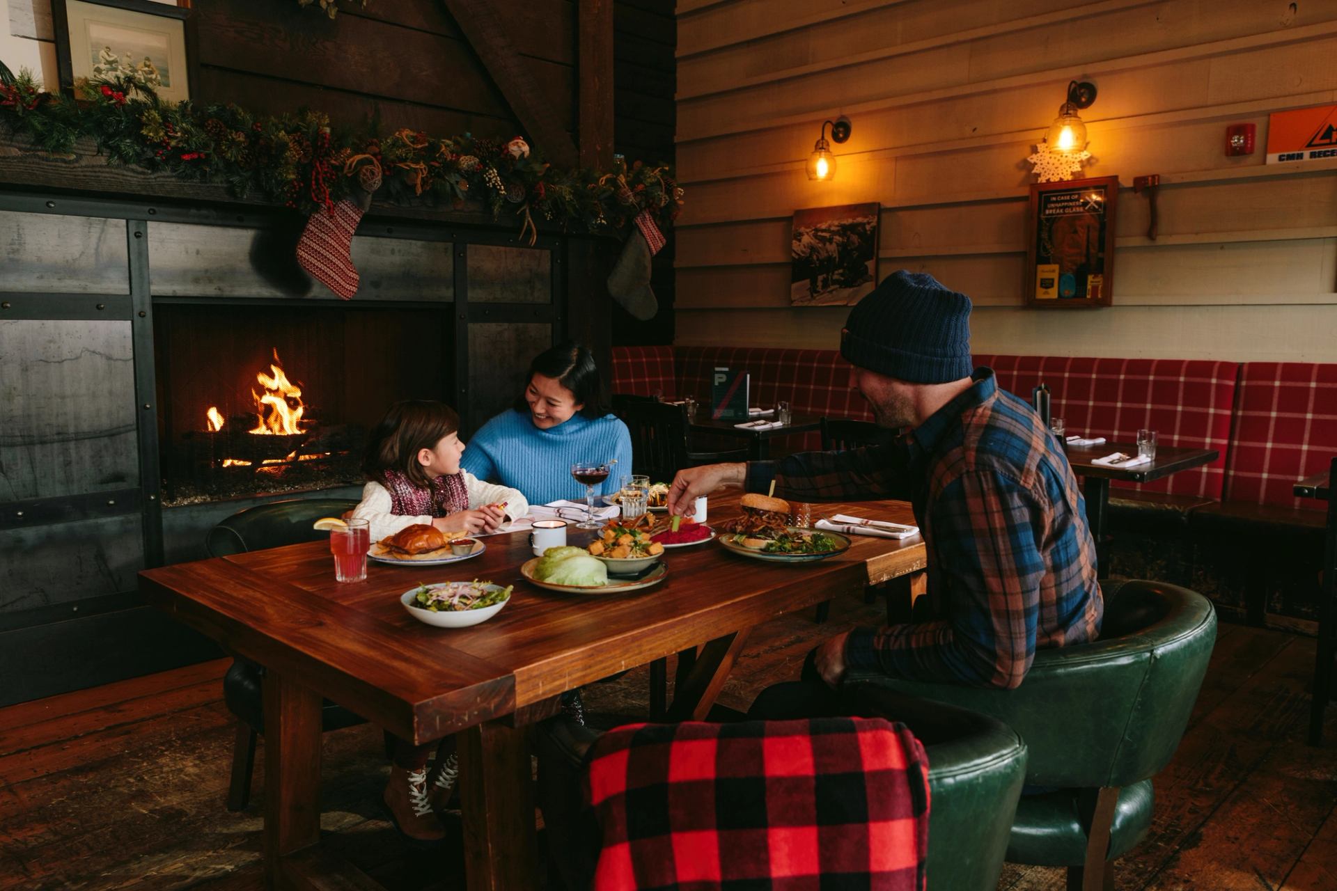 Family enjoying dinner at Park Distillery in the Banff townsite within Banff National Park