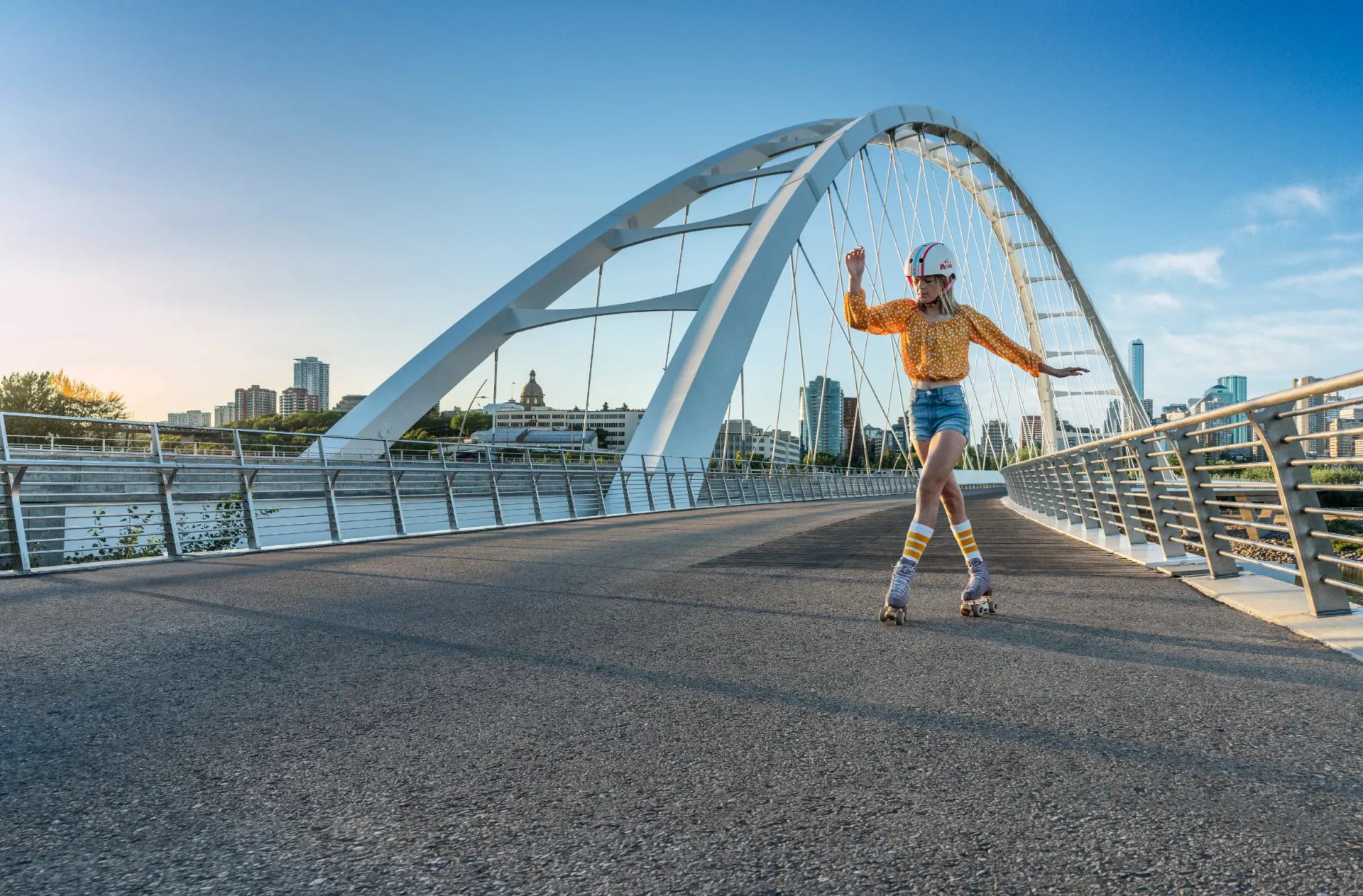 A woman roller-skates across Walterdale Bridge.