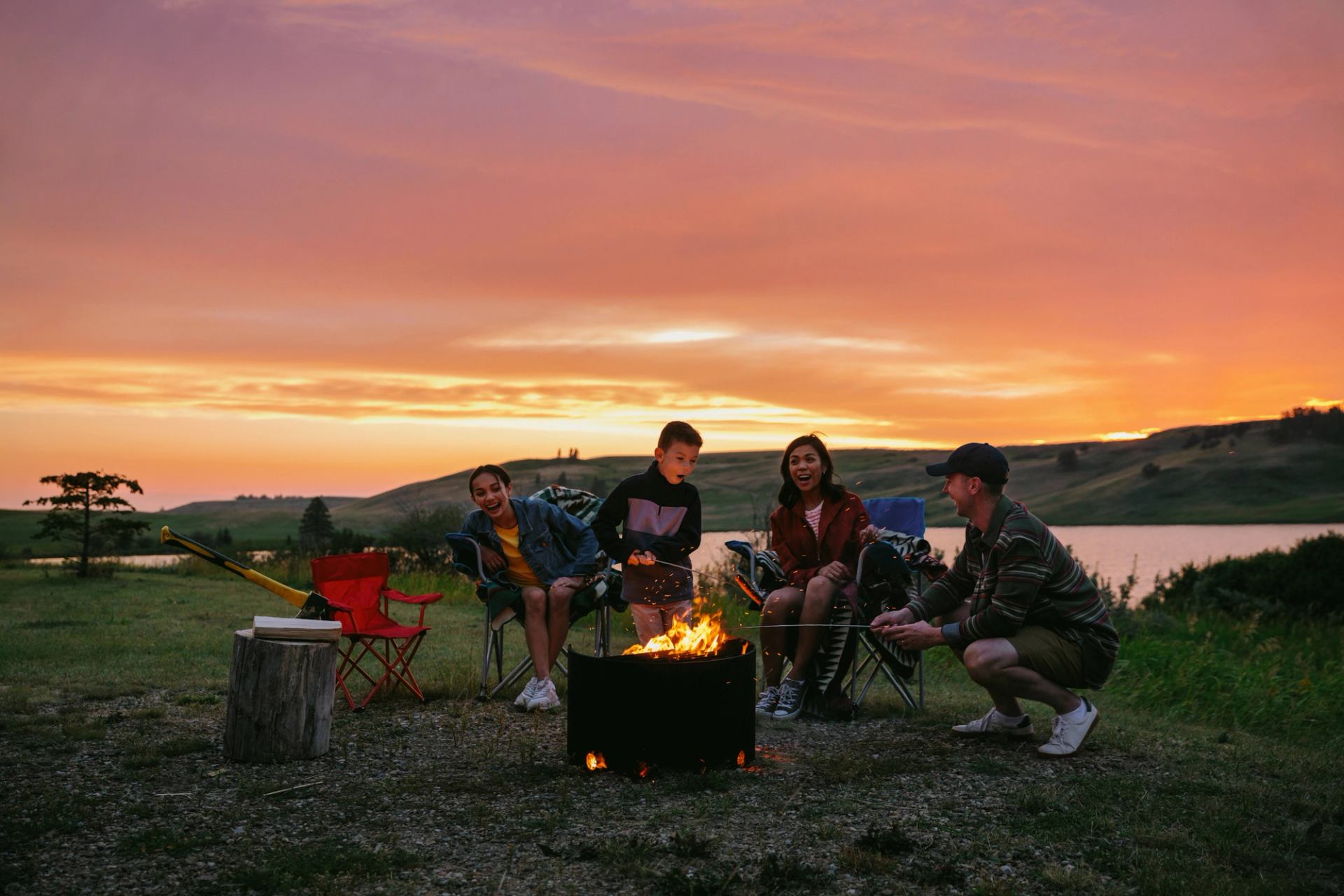 group of friends site around a campfire in Cypress Hills Provincial Park