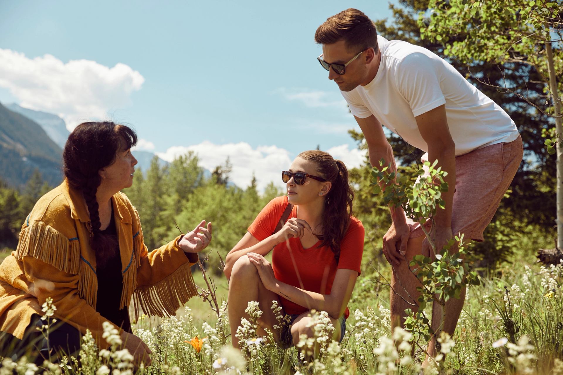 Visitors on a medicine walk with Mahikan Trails, learning about plants and their healing benefits.