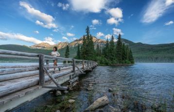 woman running across bridge pyramid lake jasper