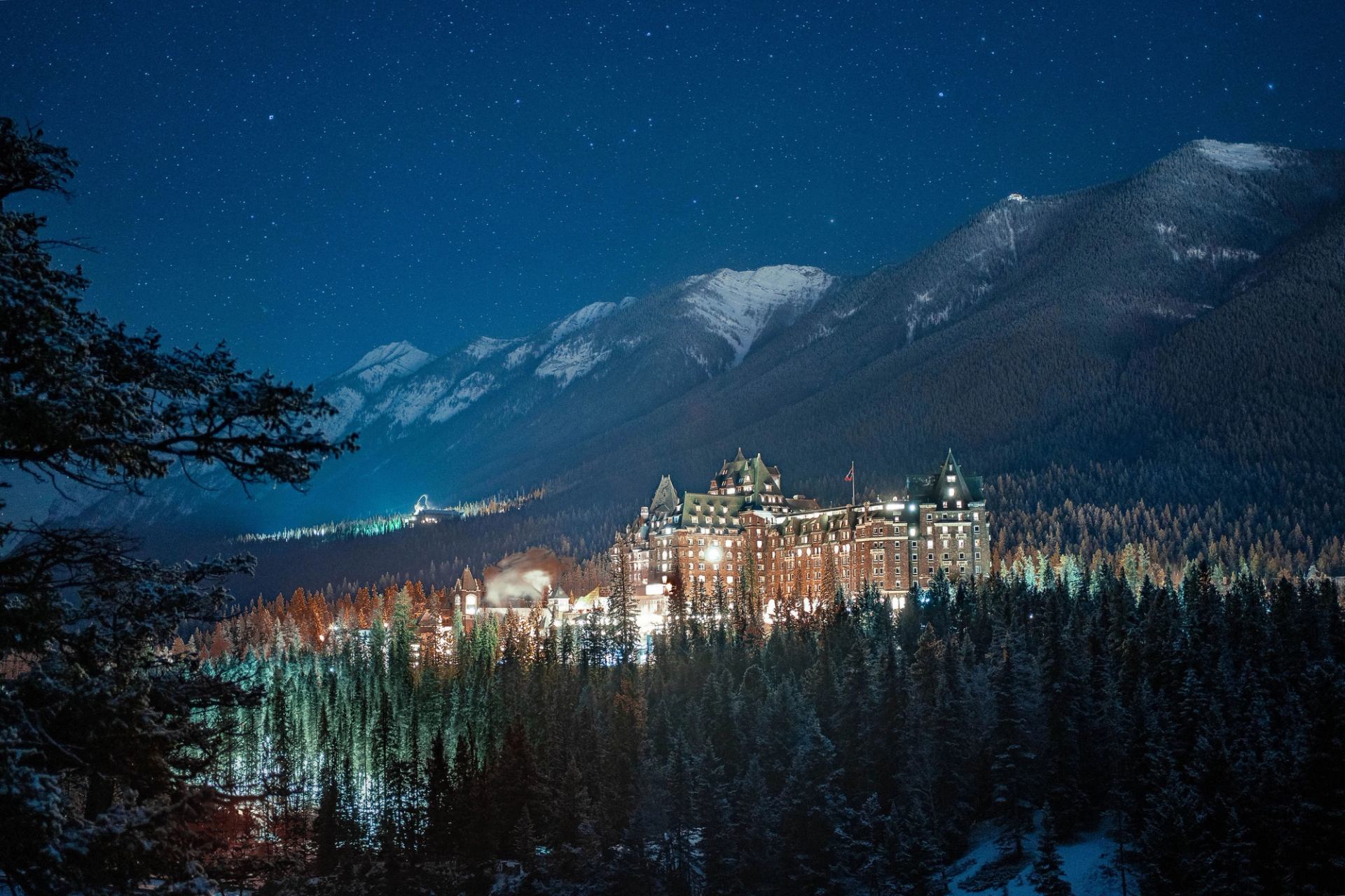 Banff Springs Hotel illuminated at night.