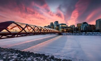 Winter sunrise/sunset scene of Peace Bridge in Calgary