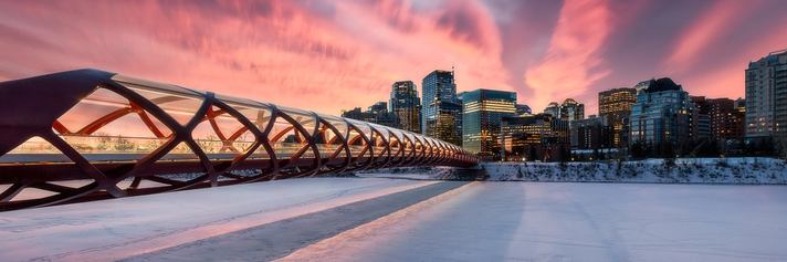 Winter sunrise/sunset scene of Peace Bridge in Calgary