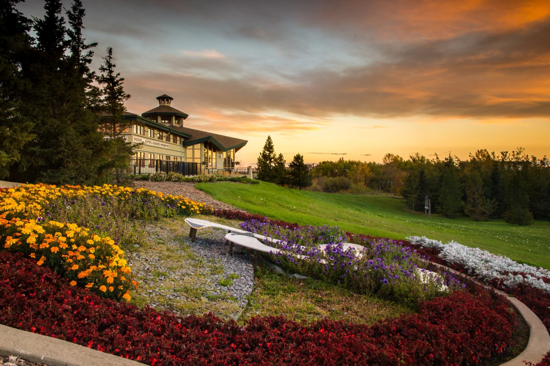 Grande Prairie Museum and Visitor Centre with the sun set in the background.