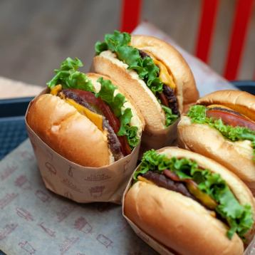 A close up of cheeseburgers.