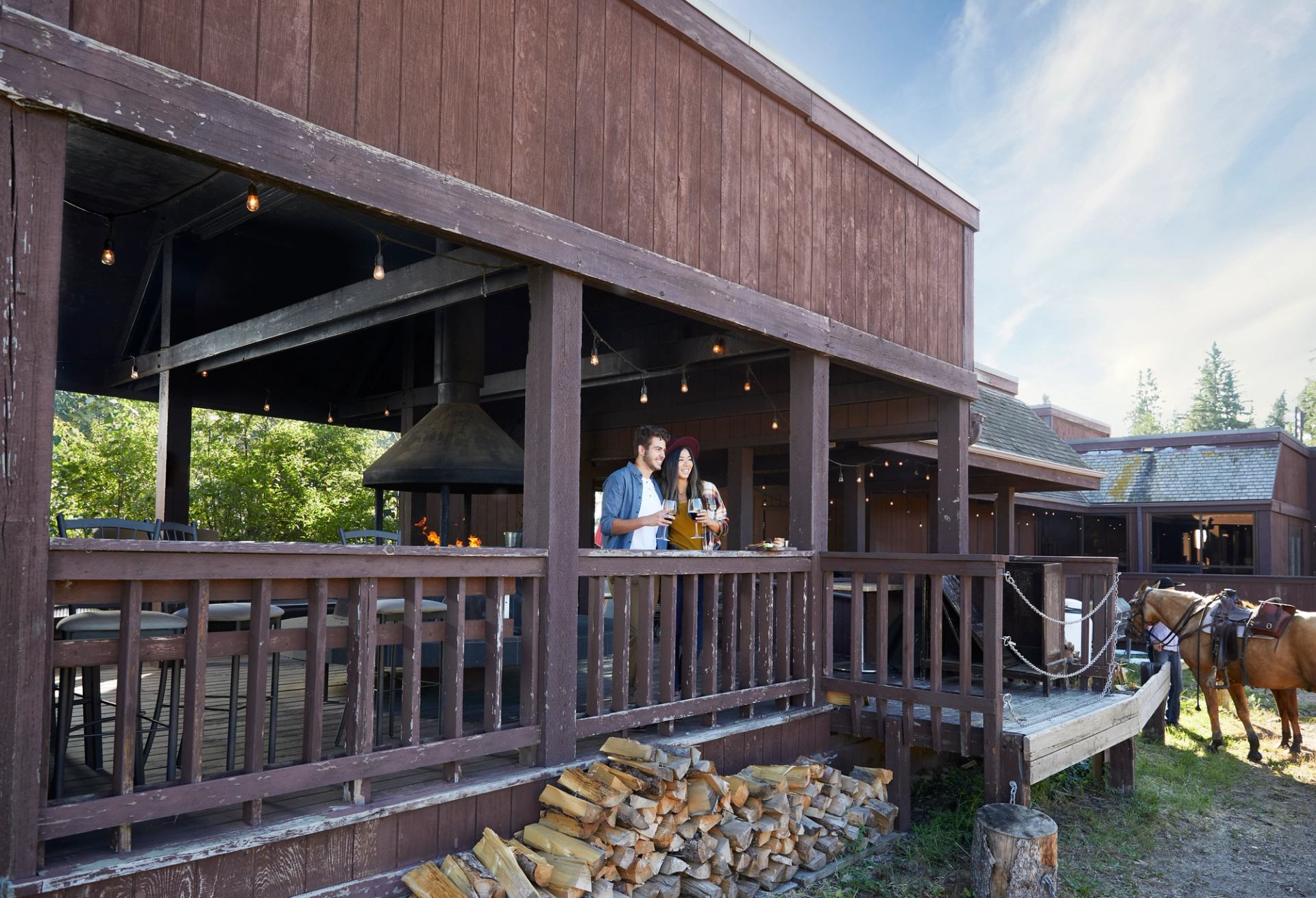 Couple standing on a patio taking in the view at the Heritage Ranch in Red Deer.