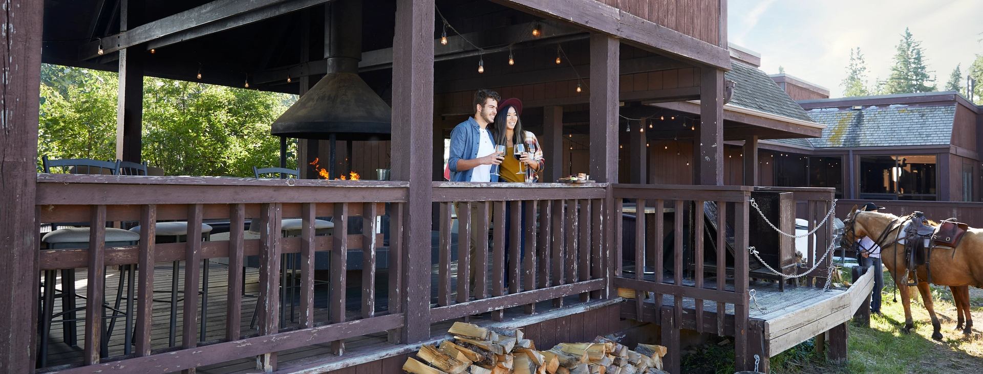 Couple standing on a patio taking in the view at the Heritage Ranch in Red Deer.