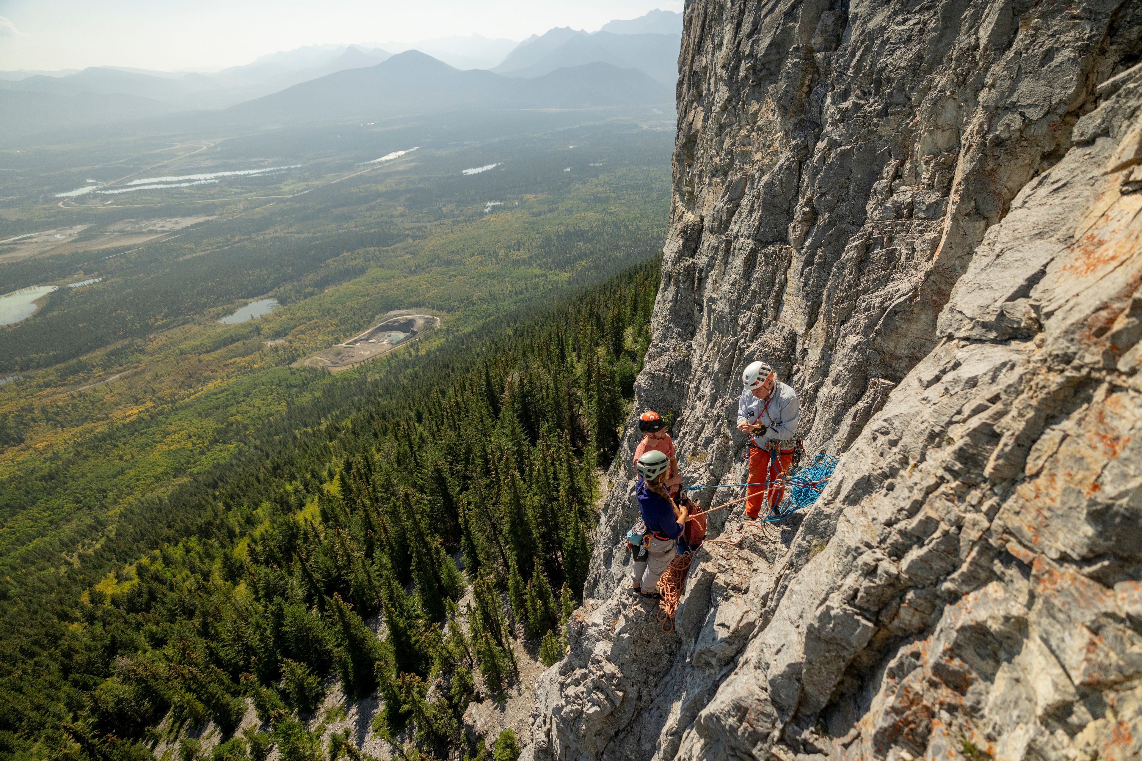 A group being shown climbing technique during a tour with Barry Blanchard and Yamnuska Mountain Adventures.