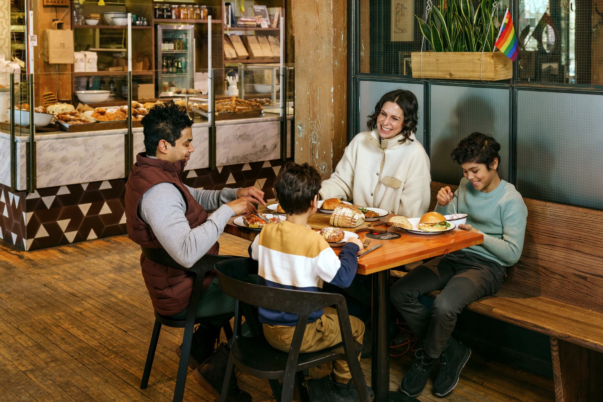 Family eating together at Simmons Building in East Village.