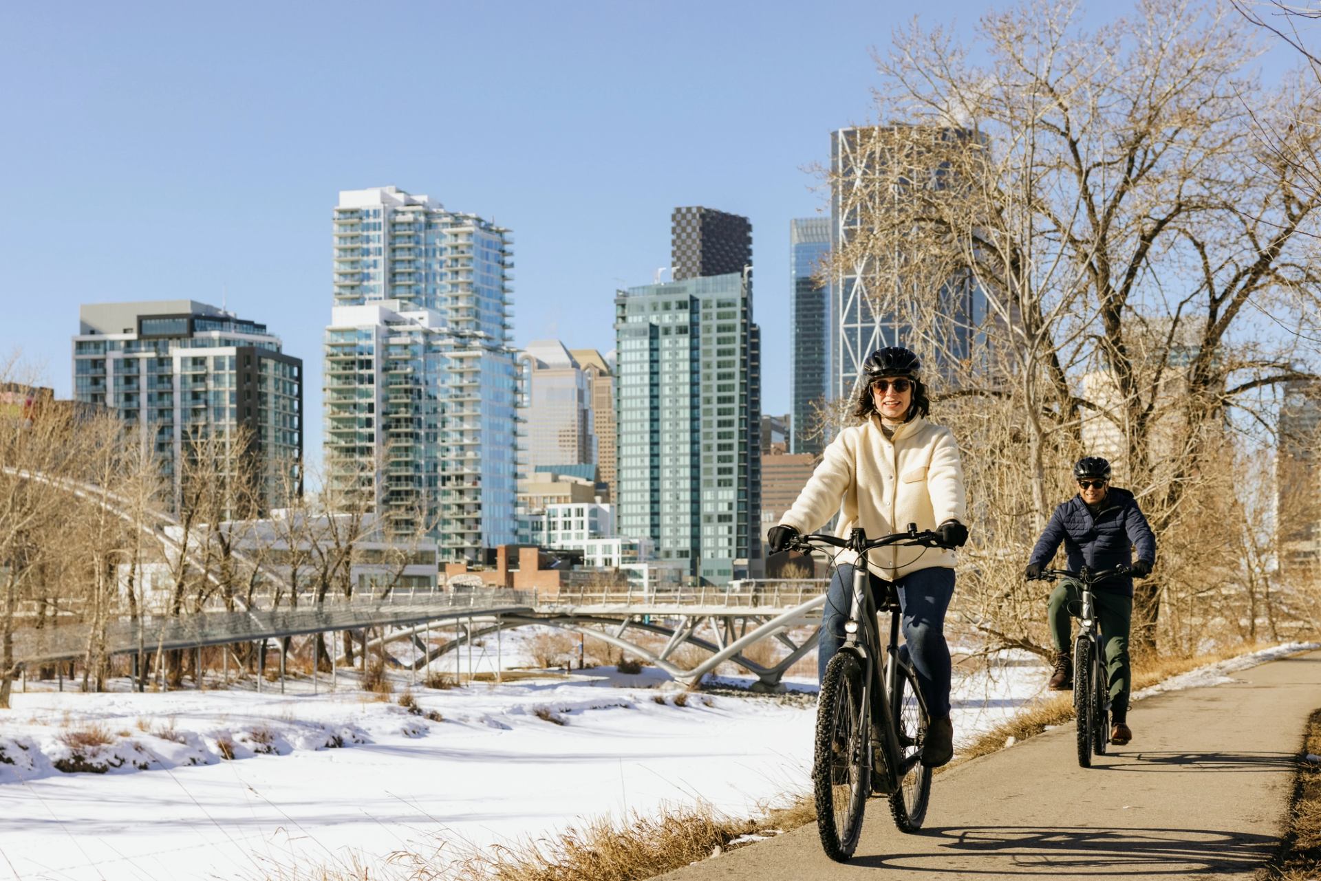 Family biking in the winter at St. Patrick's Island Park in Calgary