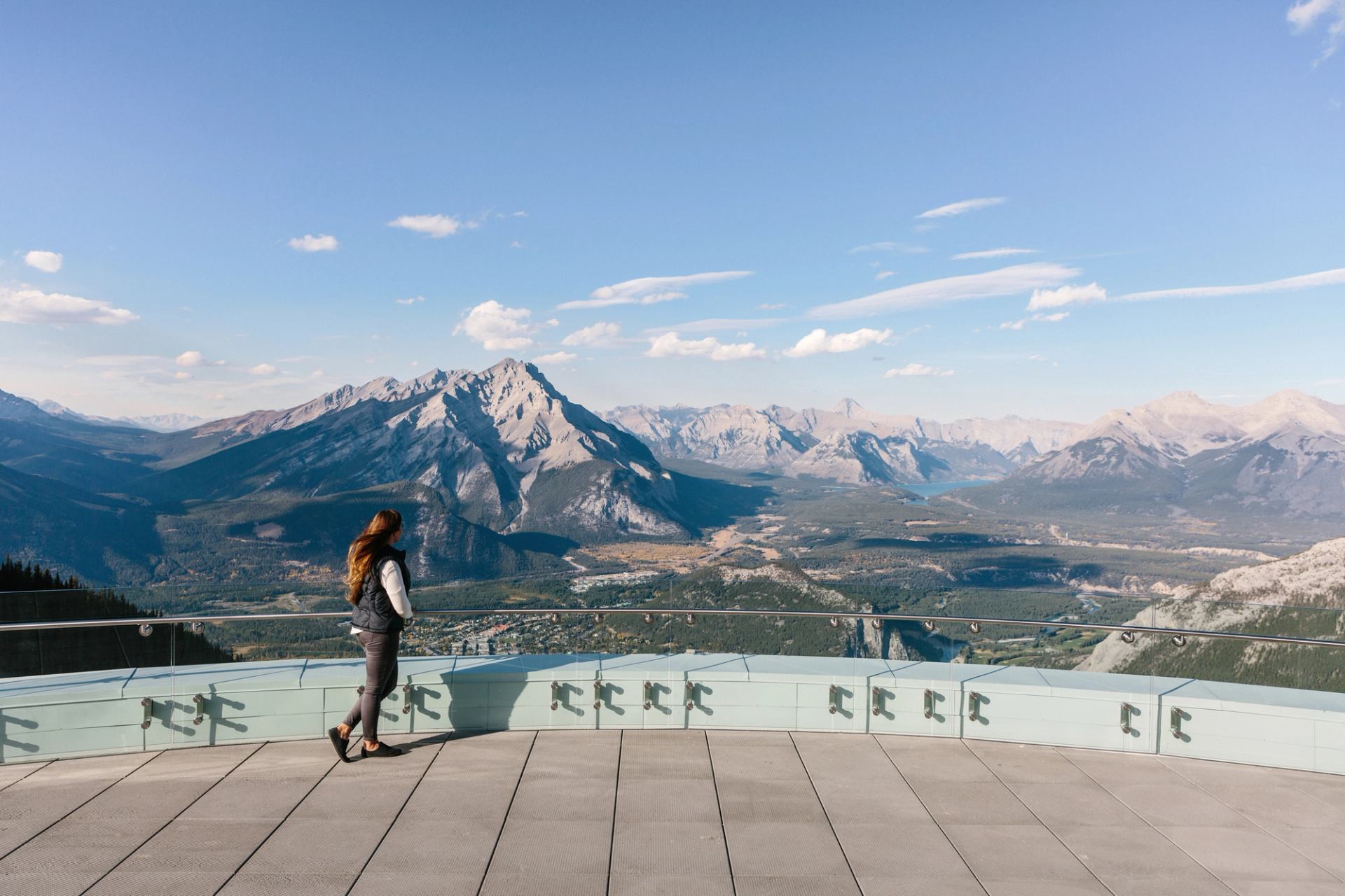 Visitor looking out over Banff National Park from the top of Sulphur Mountain