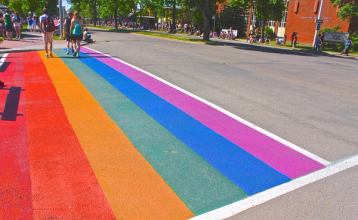 Rainbow painted on the street during the Edmonton Pride parade.